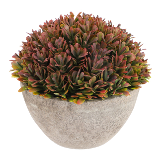 Malý umelý kvet bonsai na stole